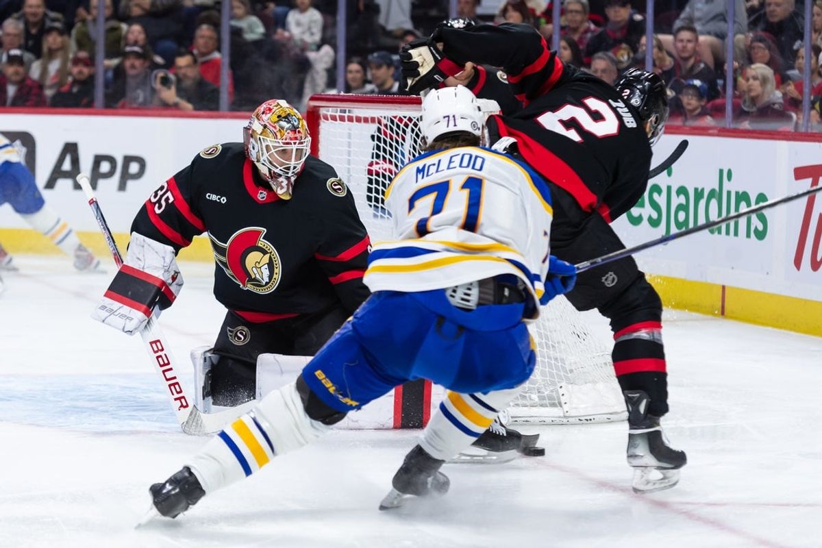 Apr 1, 2025; Ottawa, Ontario, CAN; Ottawa Senators defenseman Artem Zub (2) recovers the puck following a save by gaolie Linus Ullmark (35) on a shot from Buffalo Sabres center Ryan McLeod (71) in the second period at the Canadian Tire Centre. Mandatory Credit: Marc DesRosiers-Imagn Images