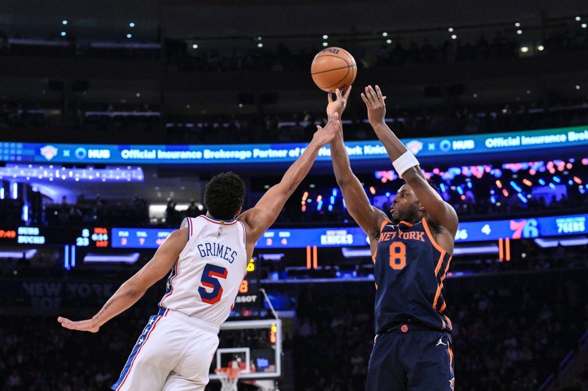 Apr 1, 2025; New York, New York, USA; New York Knicks forward OG Anunoby (8) shoots the ball while being defended by Philadelphia 76ers guard Quentin Grimes (5) during the first half at Madison Square Garden. Mandatory Credit: John Jones-Imagn Images