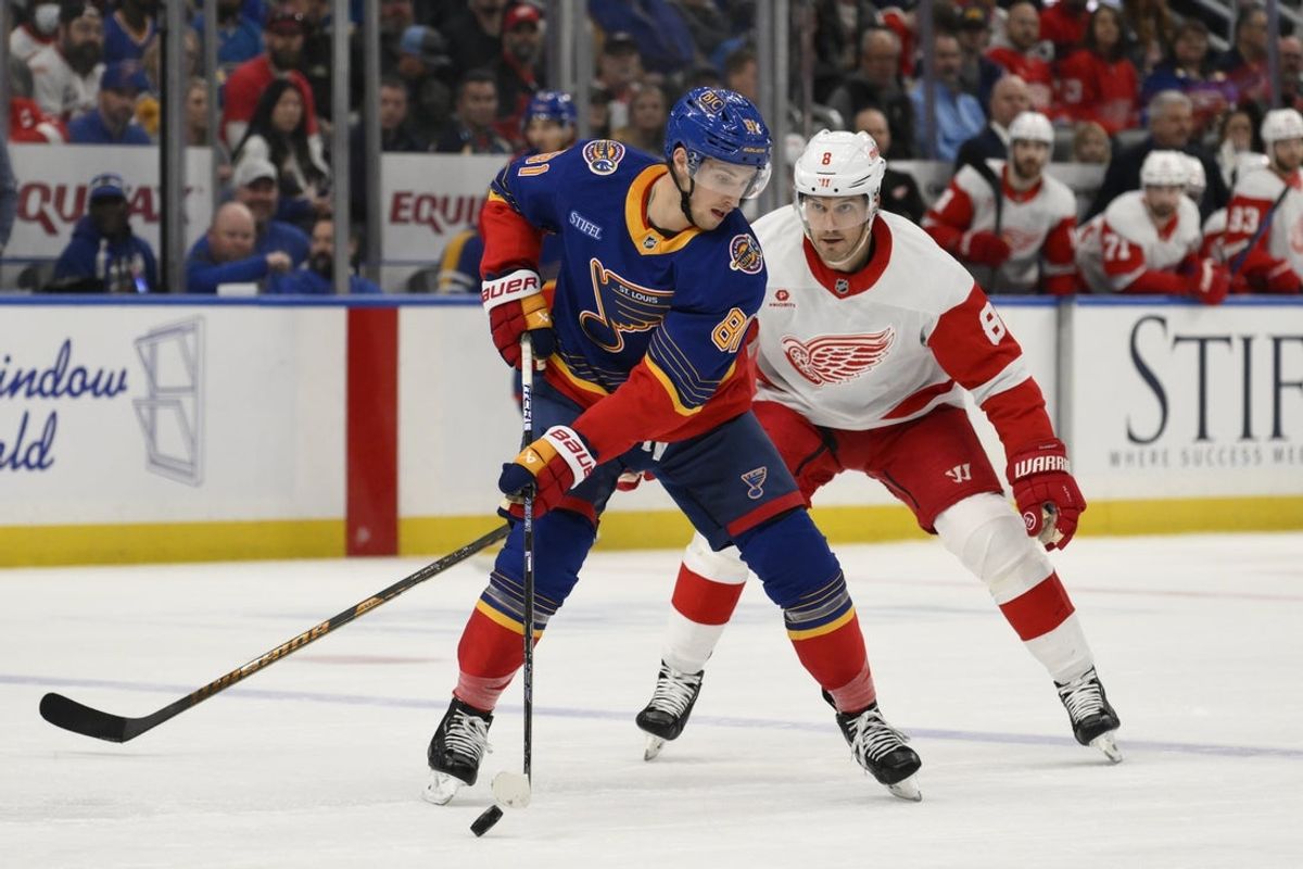 Apr 1, 2025; St. Louis, Missouri, USA; Detroit Red Wings defenseman Ben Chiarot (8) pressures St. Louis Blues center Dylan Holloway (81) during the first period at Enterprise Center. Mandatory Credit: Jeff Le-Imagn Images