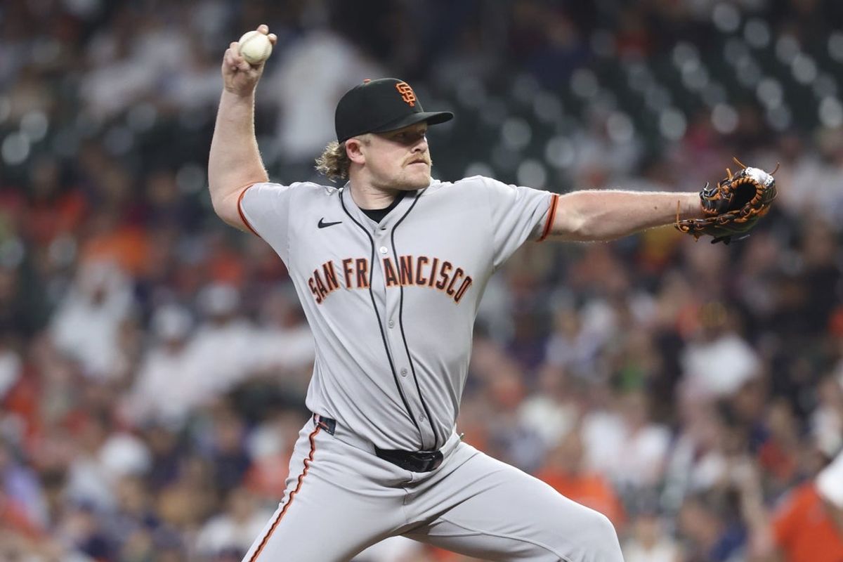 Apr 1, 2025; Houston, Texas, USA; San Francisco Giants starting pitcher Logan Webb (62) delivers a pitch during the second inning against the Houston Astros at Daikin Park. Mandatory Credit: Troy Taormina-Imagn Images