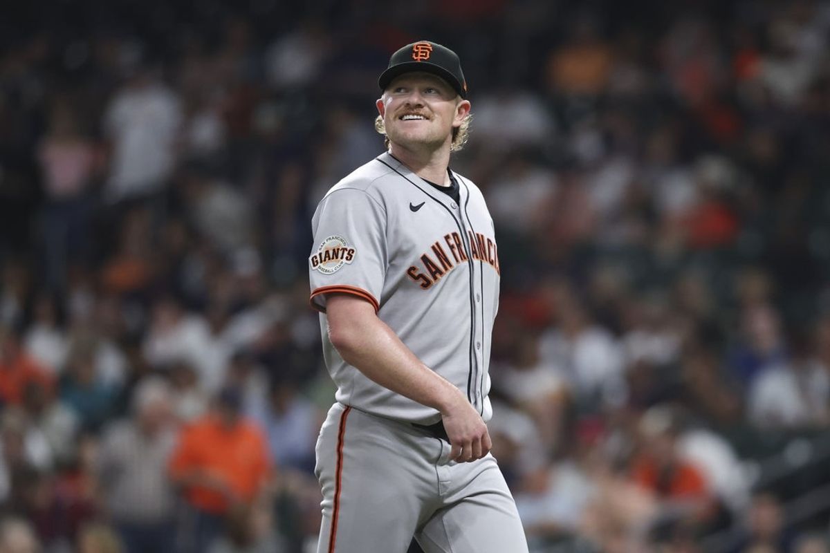 Apr 1, 2025; Houston, Texas, USA; San Francisco Giants starting pitcher Logan Webb (62) smiles while walking off the mound after pitching during the second inning against the Houston Astros at Daikin Park. Mandatory Credit: Troy Taormina-Imagn Images