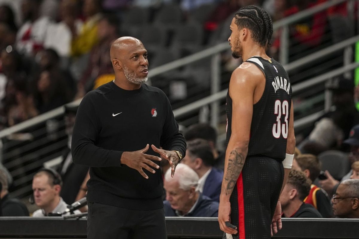 Apr 1, 2025; Atlanta, Georgia, USA; Portland Trail Blazers head coach Chauncey Billups talks to forward Toumani Camara (33) during the game against the Atlanta Hawks during the second half at State Farm Arena. Mandatory Credit: Dale Zanine-Imagn Images