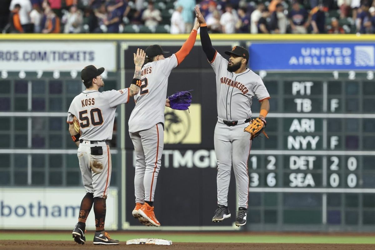 Apr 1, 2025; Houston, Texas, USA; San Francisco Giants shortstop Willy Adames (2) celebrates with left fielder Heliot Ramos (17) after the game against the Houston Astros at Daikin Park. Mandatory Credit: Troy Taormina-Imagn Images