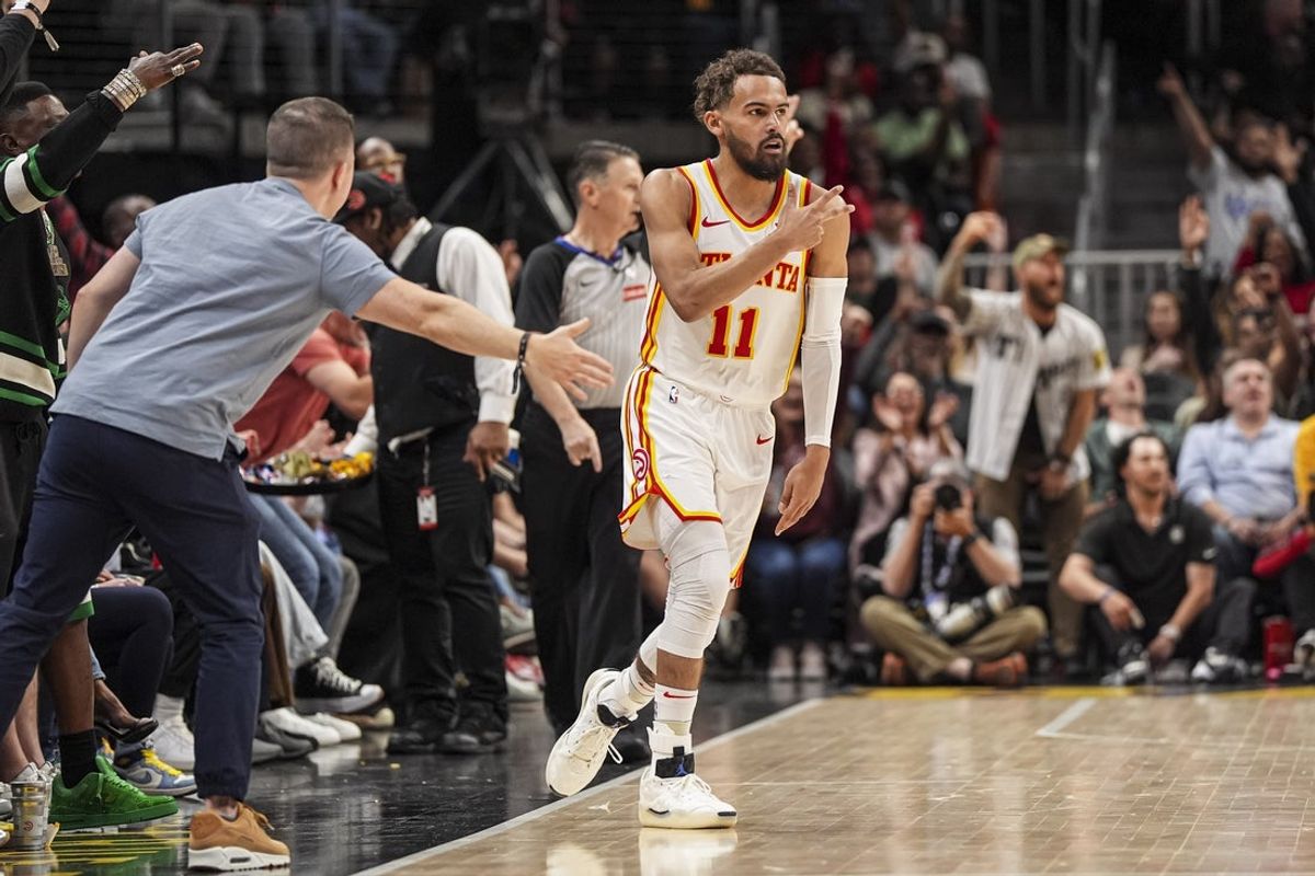 Apr 1, 2025; Atlanta, Georgia, USA; Atlanta Hawks guard Trae Young (11) reacts with fans after making a three point shot against the Portland Trail Blazers during the second half at State Farm Arena. Mandatory Credit: Dale Zanine-Imagn Images