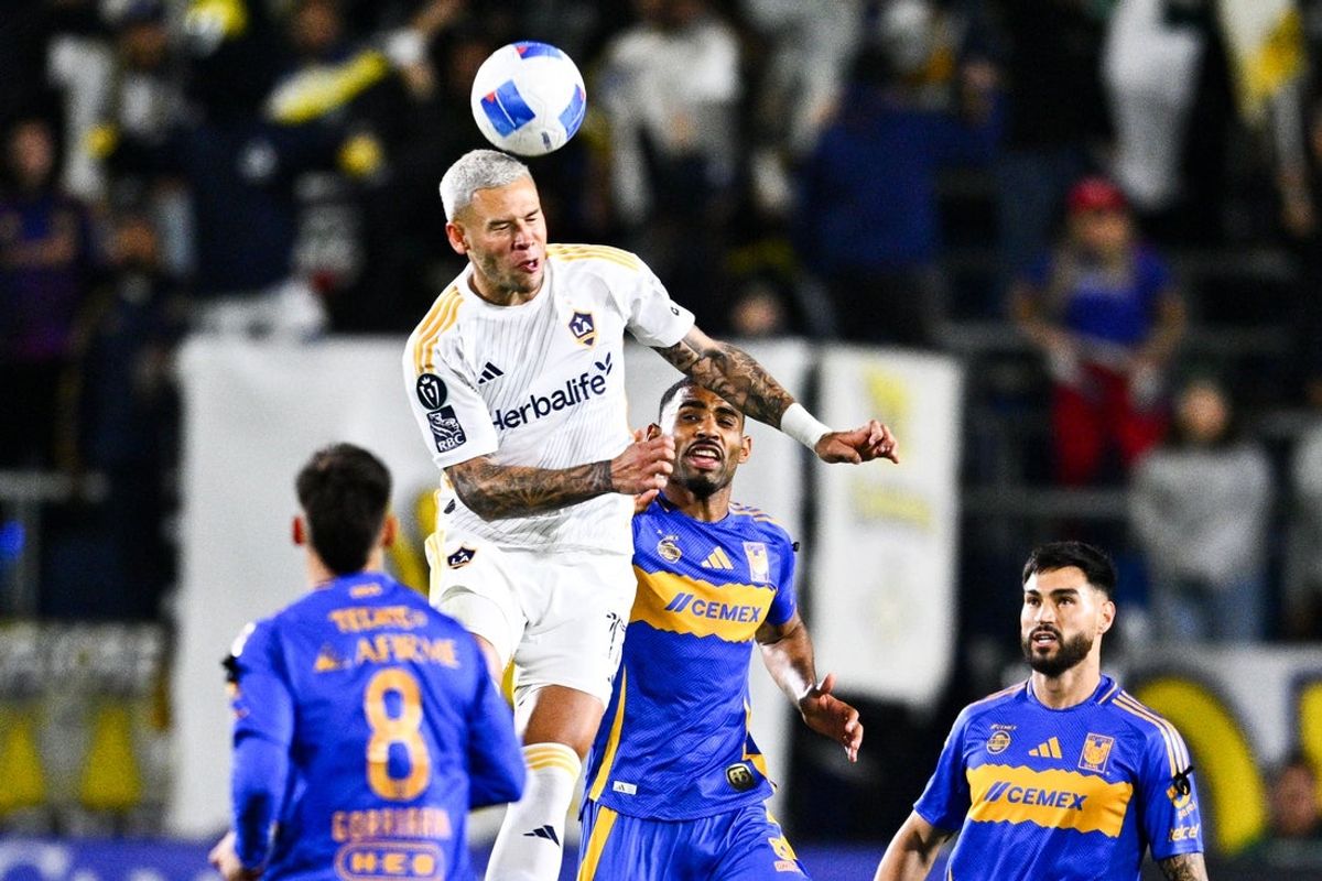 Apr 1, 2025; Carson, California, USA; LA Galaxy forward Christian Ramírez (17) heads the ball away from Tigres UANL defender Joaquim (2) during the first half at Dignity Health Sports Park. Mandatory Credit: Kelvin Kuo-Imagn Images