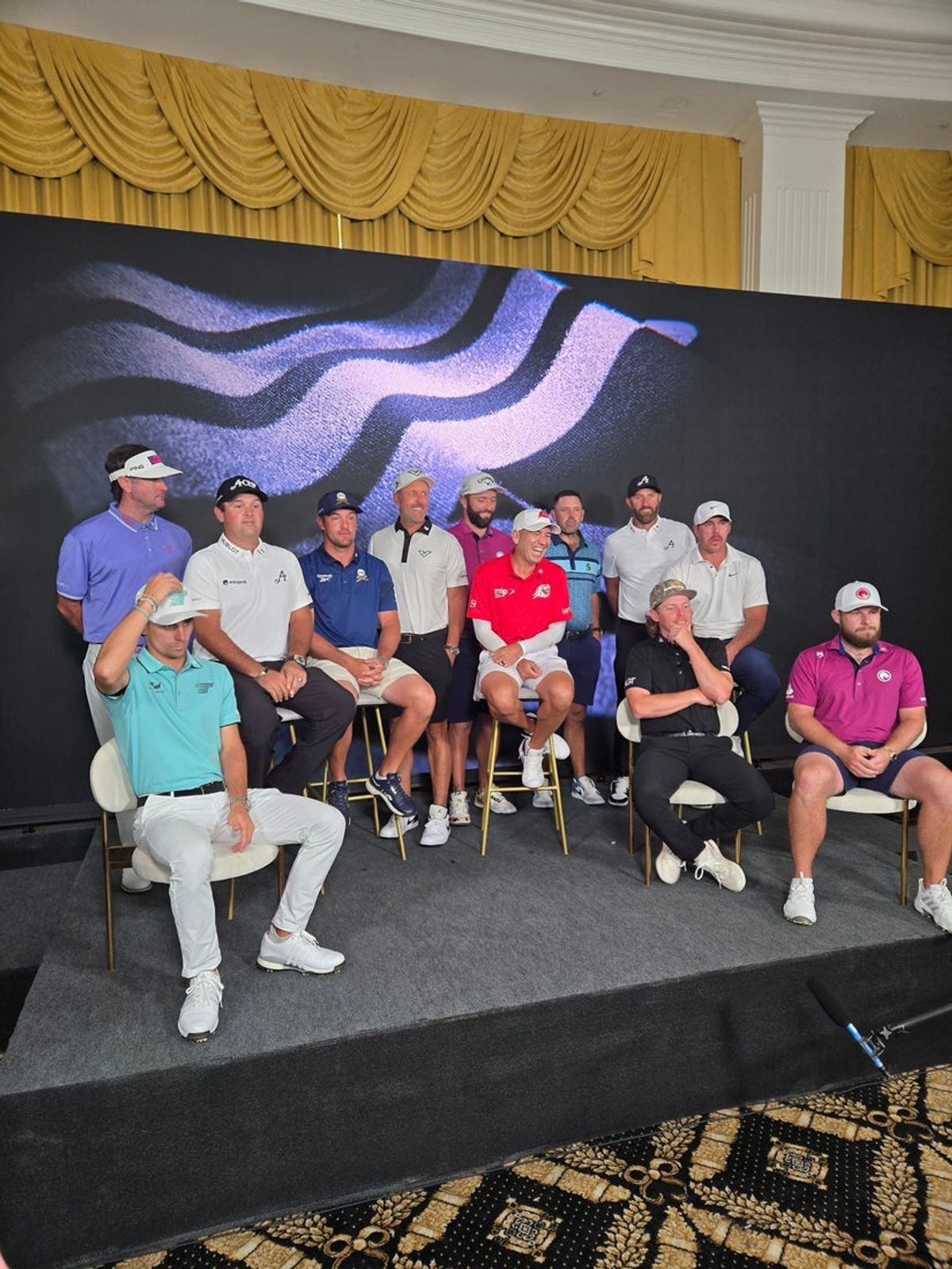 From left front, Joaquin Niemann, Bubba Watson, Patrick Reed, Bryson Dechambeau, Phil Mickelson, Jon Rahm, Sergio Garcia, Charl Schwartzel, Dustin Johnson, Brooks Koepka, Cam Smith and Tyrell Hatton at media day ahead of LIV Golf Miami at Trump National Doral Miami on April 2, 2025.