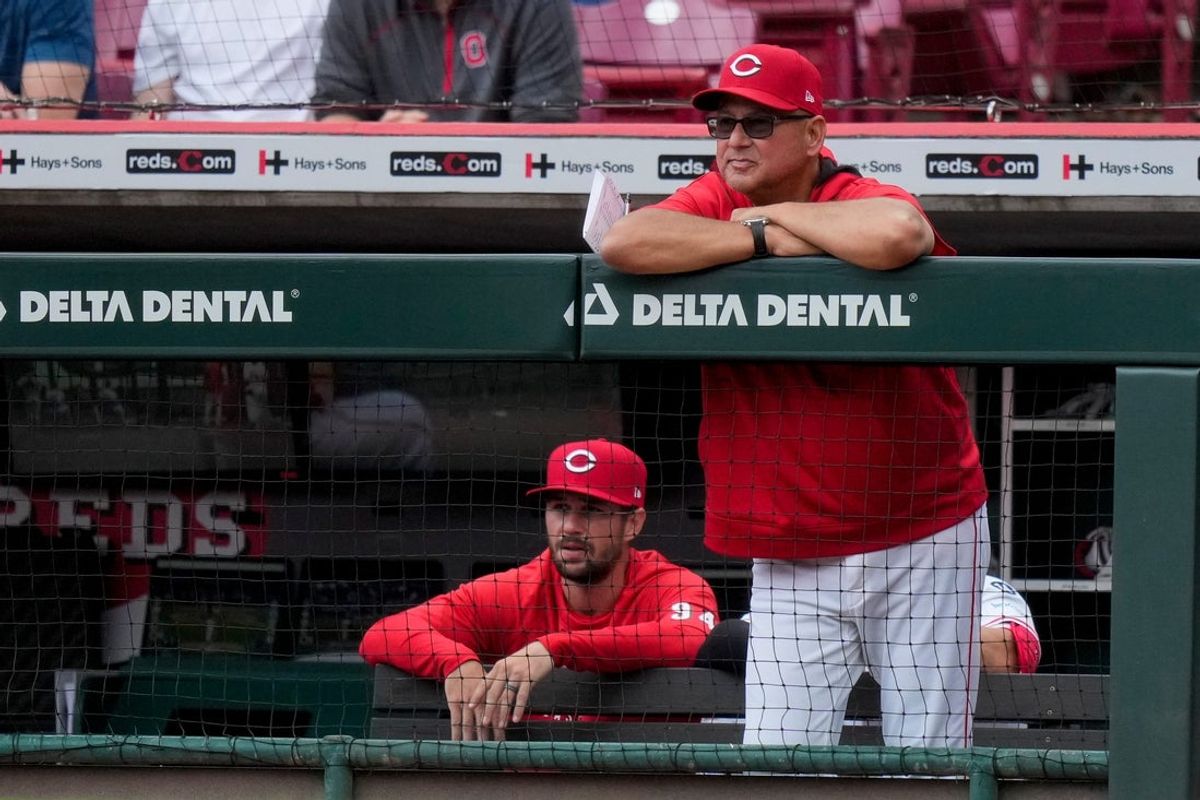Cincinnati Reds manager Terry Francona (77) looks on from the dugout in the seventh inning of the MLB Interleague game between the Cincinnati Reds and the Texas Rangers at Great American Ball Park in downtown Cincinnati on Wednesday, April 2, 2025. The Rangers won 1-0.