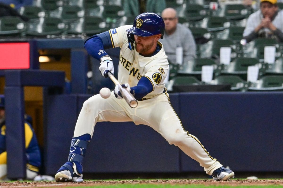 Apr 2, 2025; Milwaukee, Wisconsin, USA; Milwaukee Brewers second baseman Brice Turang (2) squeezes in the winning run in the eleventh inning against the Kansas City Royals at American Family Field. Mandatory Credit: Benny Sieu-Imagn Images