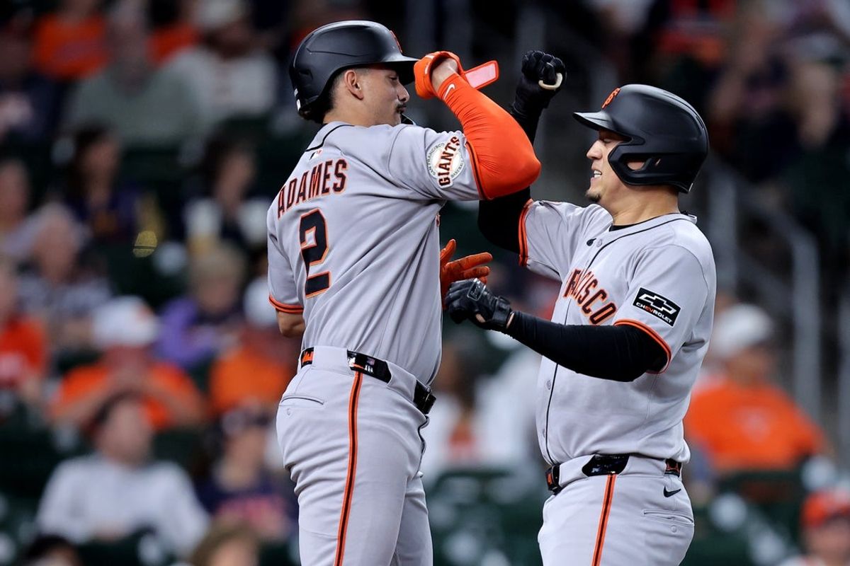 Apr 2, 2025; Houston, Texas, USA; San Francisco Giants first baseman Wilmer Flores (41) is congratulated byshortstop Willy Adames (2) after hitting a two run home run to left field against the Houston Astros during the first inning at Daikin Park. Mandatory Credit: Erik Williams-Imagn Images