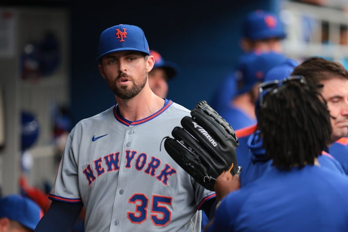 Apr 2, 2025; Miami, Florida, USA; New York Mets starting pitcher Clay Holmes (35) celebrates with teammates after leaving the game against the Miami Marlins during the fifth inning at loanDepot Park. Mandatory Credit: Sam Navarro-Imagn Images