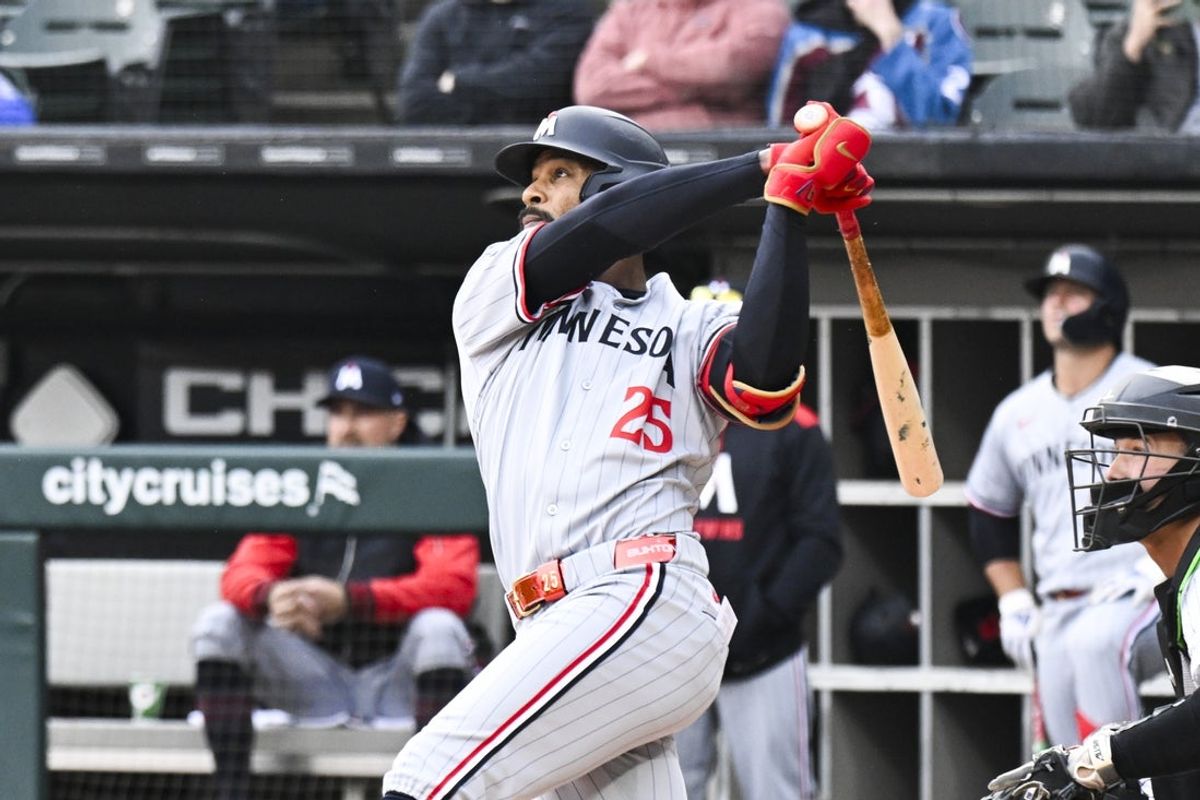 Apr 2, 2025; Chicago, Illinois, USA;  Minnesota Twins outfielder Byron Buxton (25) hits a home run against the Chicago White Sox during the first inning at Guaranteed Rate Field. Mandatory Credit: Matt Marton-Imagn Images
