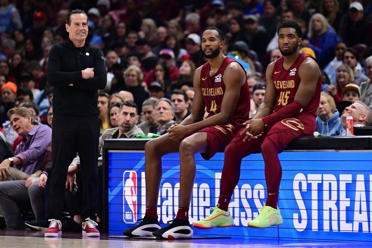 Apr 2, 2025; Cleveland, Ohio, USA;  Cleveland Cavaliers forward Evan Mobley (4) and guard Donovan Mitchell (45) wait along side head coach Kenny Atkinson to enter the game during the first half against the New York Knicks at Rocket Arena. Mandatory Credit: Ken Blaze-Imagn Images