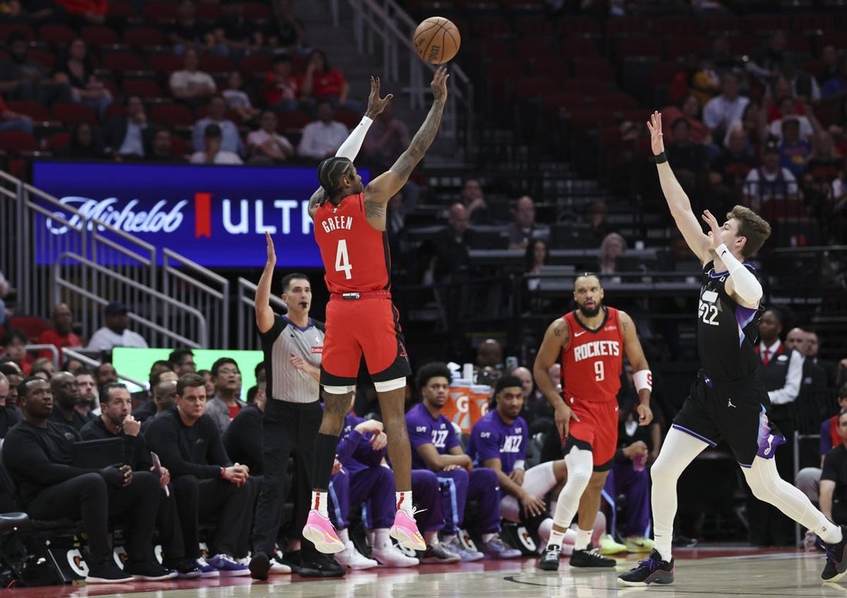 Apr 2, 2025; Houston, Texas, USA; Houston Rockets guard Jalen Green (4) shoots the ball as Utah Jazz forward Kyle Filipowski (22) defends during the first quarter at Toyota Center. Mandatory Credit: Troy Taormina-Imagn Images