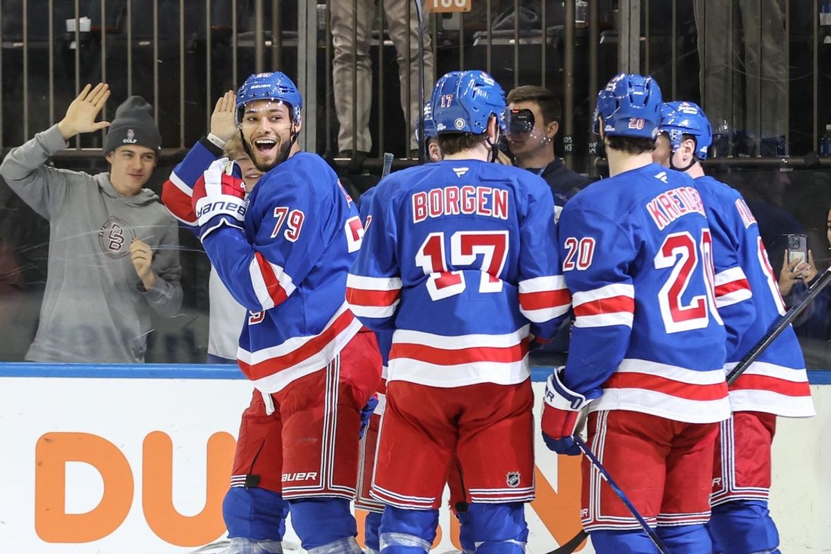 Apr 2, 2025; New York, New York, USA;  New York Rangers defenseman K'Andre Miller (79) celebrates with his teammates after scoring a goal in the second period against the Minnesota Wild at Madison Square Garden. Mandatory Credit: Wendell Cruz-Imagn Images