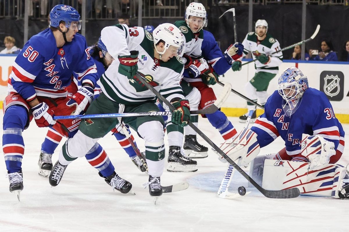 Apr 2, 2025; New York, New York, USA;  New York Rangers goaltender Igor Shesterkin (31) defends against a shot on goal attempt by Minnesota Wild center Marco Rossi (23) in the third period at Madison Square Garden. Mandatory Credit: Wendell Cruz-Imagn Images
