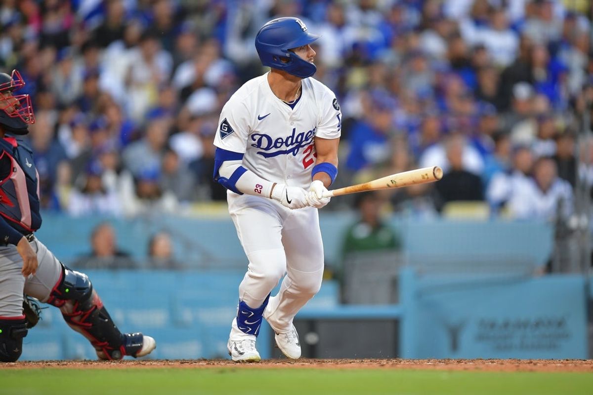 Apr 2, 2025; Los Angeles, California, USA; Los Angeles Dodgers outfielder Michael Conforto (23) hits a solo home run against the Atlanta Braves during the fifth inning at Dodger Stadium. Mandatory Credit: Gary A. Vasquez-Imagn Images