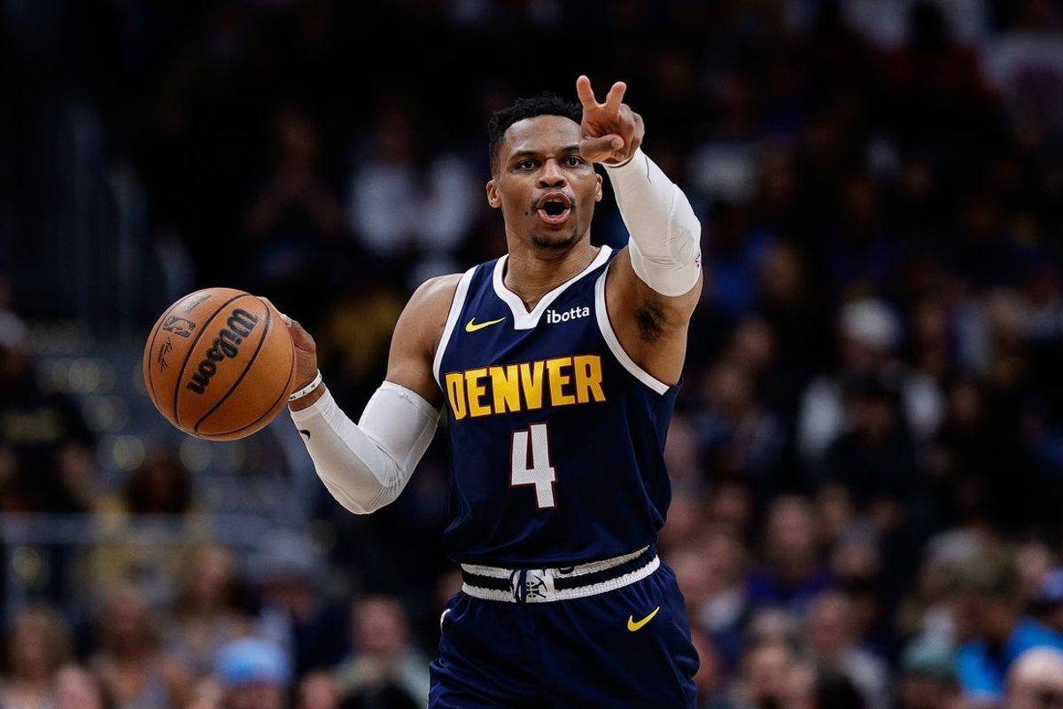 Apr 2, 2025; Denver, Colorado, USA; Denver Nuggets guard Russell Westbrook (4) gestures as he dribbles the ball up court in the third quarter against the San Antonio Spurs at Ball Arena. Mandatory Credit: Isaiah J. Downing-Imagn Images