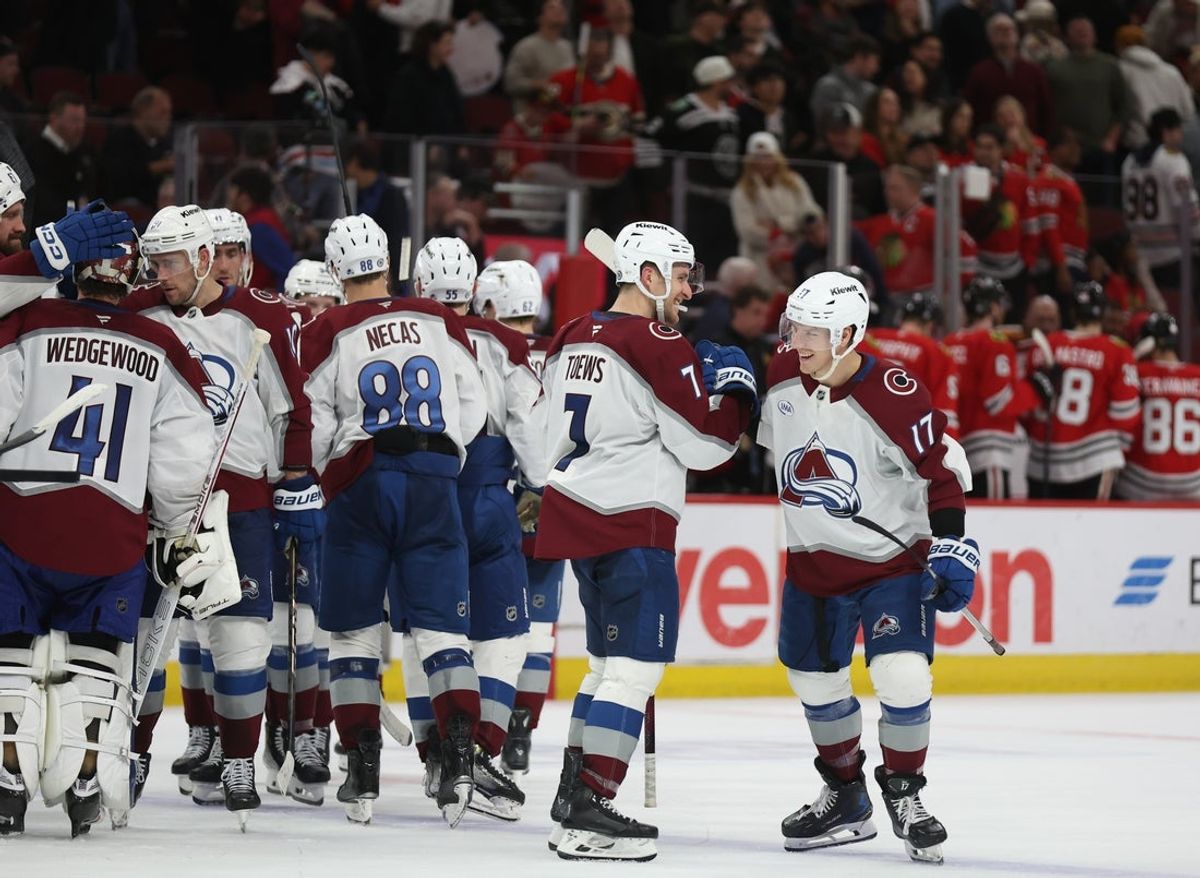 Apr 2, 2025; Chicago, Illinois, USA; Colorado Avalanche defenseman Devon Toews (7) and center Parker Kelly (17) celebrate defeating the Chicago Blackhawks at United Center. Mandatory Credit: Talia Sprague-Imagn Images
