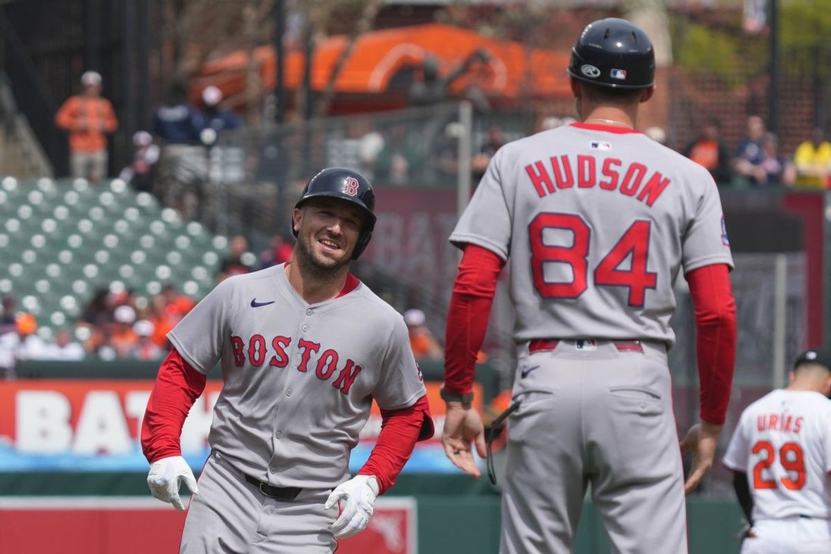 Apr 3, 2025; Baltimore, Maryland, USA; Boston Red Sox third baseman Alex Bregman (2) greeted by coach Kyle Hudson (84) following his two-run home run in the first inning against the Baltimore Orioles at Oriole Park at Camden Yards. Mandatory Credit: Mitch Stringer-Imagn Images