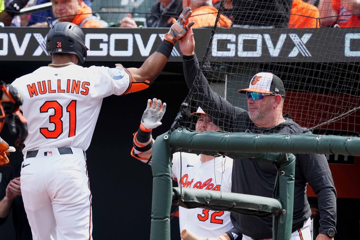 Apr 3, 2025; Baltimore, Maryland, USA; Baltimore Orioles outfielder Cedric Mullins (31) greeted by manager Brandon Hyde (18) following his solo home run in the first inning against the Boston Red Sox at Oriole Park at Camden Yards. Mandatory Credit: Mitch Stringer-Imagn Images