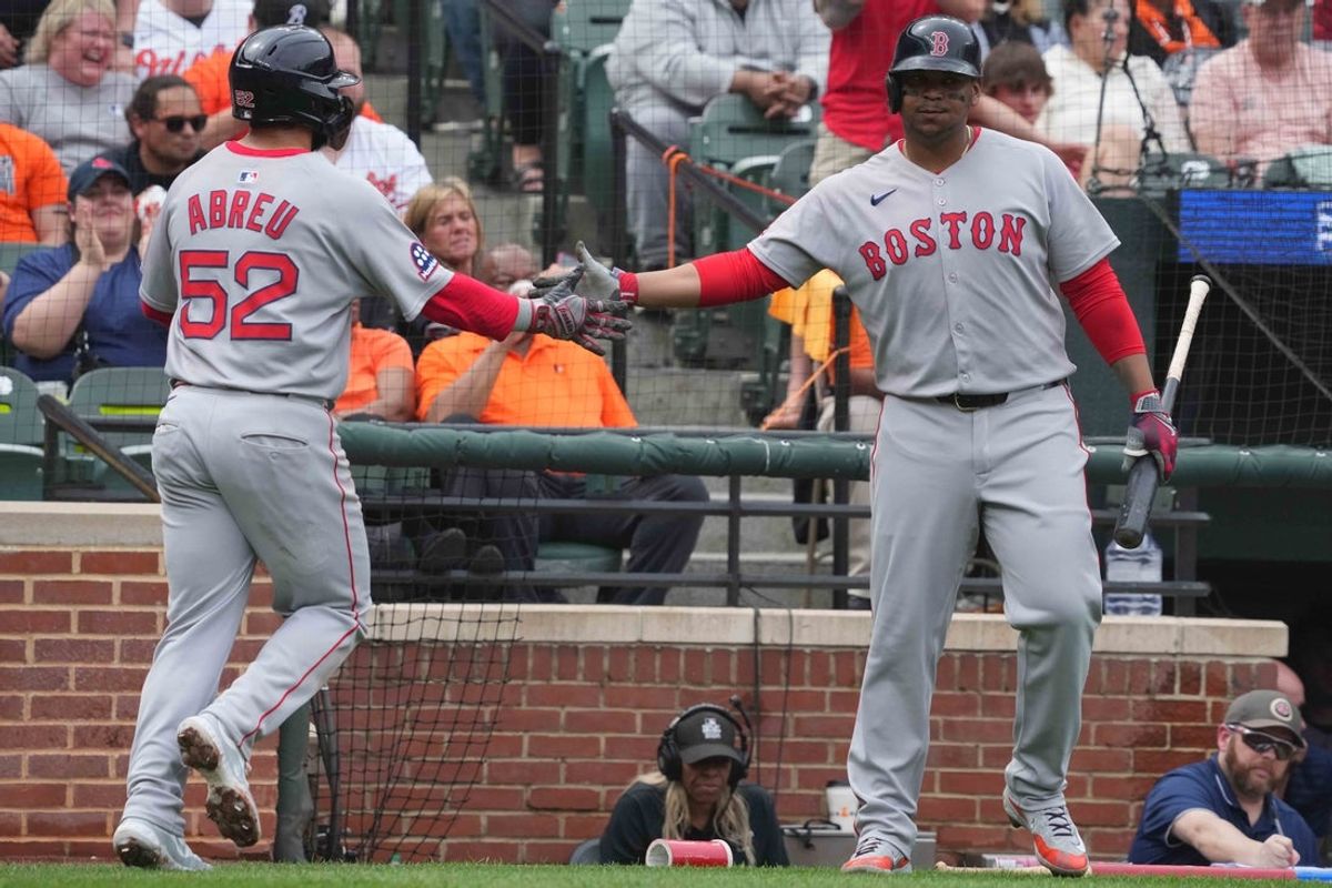 Apr 3, 2025; Baltimore, Maryland, USA; Boston Red Sox outfielder Wilyer Abreau (52) greeted in the fourth inning by designated hitter Rafael Devers (11) after scoring against the Baltimore Orioles at Oriole Park at Camden Yards. Mandatory Credit: Mitch Stringer-Imagn Images