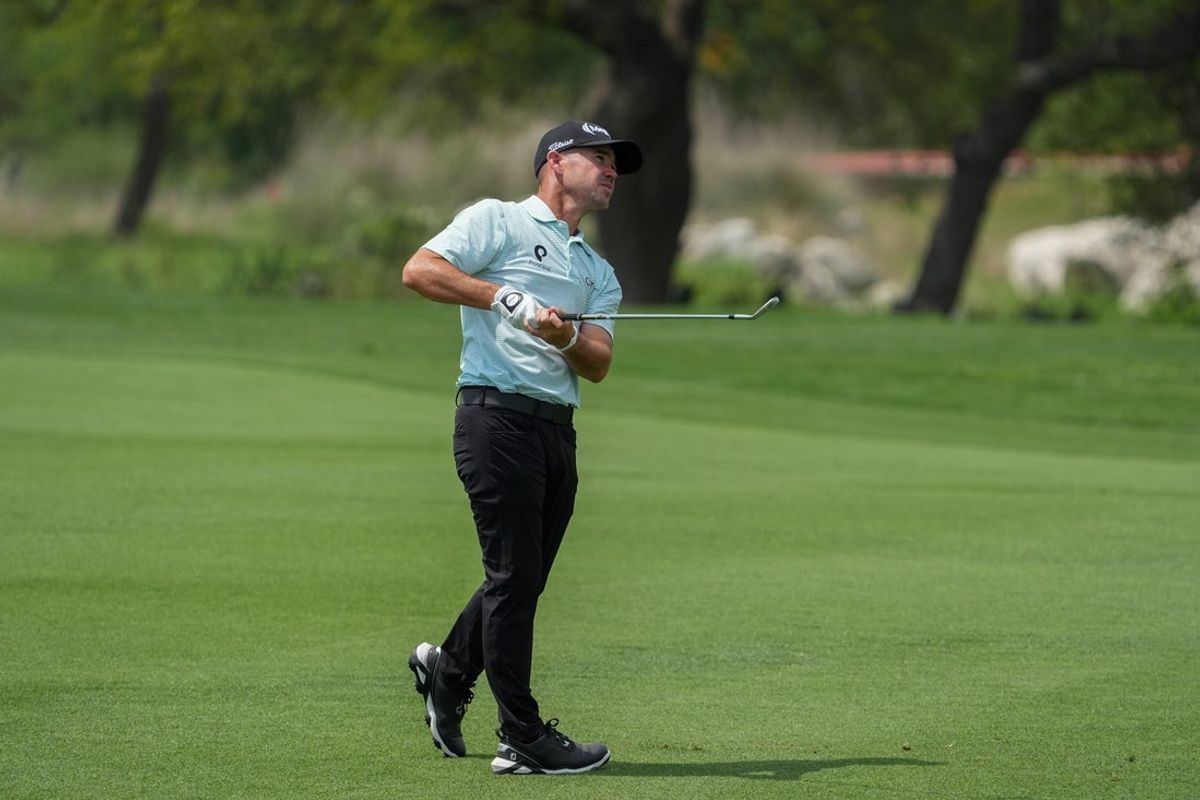 Apr 3, 2025; San Antonio, Texas, USA; Brian Harman watches his shot on the 18th fairway during the first round of the Valero Texas Open golf tournament. Mandatory Credit: Daniel Dunn-Imagn Images