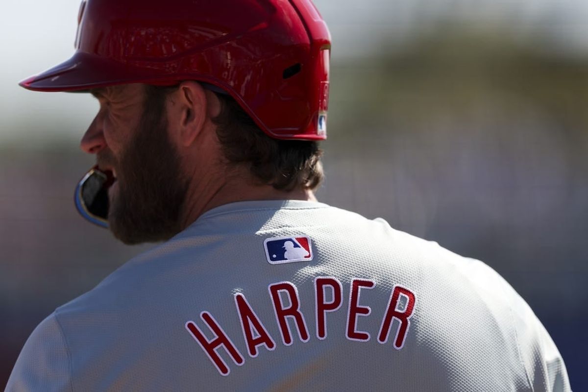 Mar 4, 2024; Dunedin, Florida, USA;  Philadelphia Phillies first baseman Bryce Harper (3) looks on from the on deck circle during a game against the Toronto Blue Jays in the third inning at TD Ballpark.