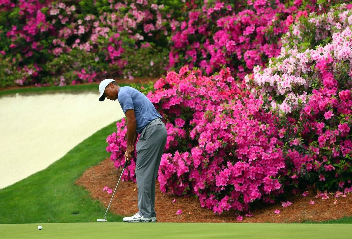 Tiger Woods putts on the 13th green during a practice round for the Masters golf tournament at Augusta National Golf Club in 2019.