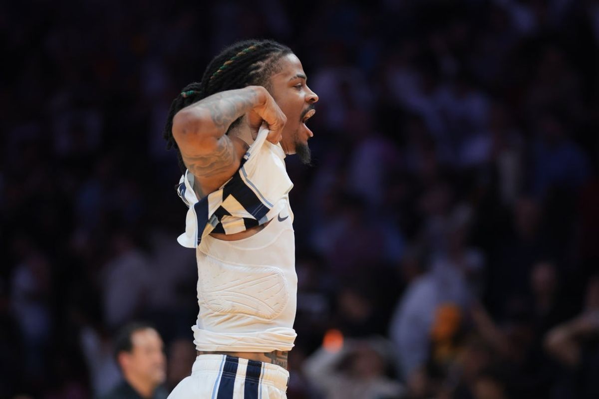 Apr 3, 2025; Miami, Florida, USA; Memphis Grizzlies guard Ja Morant (12) reacts after scoring the game-winning shot against the Miami Heat during the fourth quarter at Kaseya Center. Mandatory Credit: Sam Navarro-Imagn Images