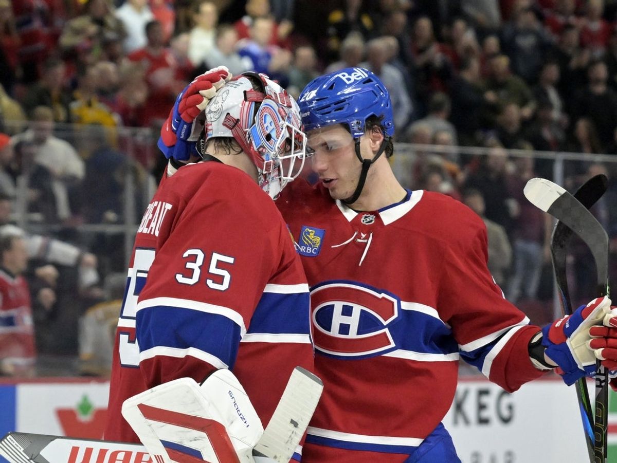 Apr 3, 2025; Montreal, Quebec, CAN; Montreal Canadiens goalie Sam Montembeault (35) and teammate forward Juraj Slafkovsky (20) celebrate the win against the Boston Bruins at the Bell Centre. Mandatory Credit: Eric Bolte-Imagn Images