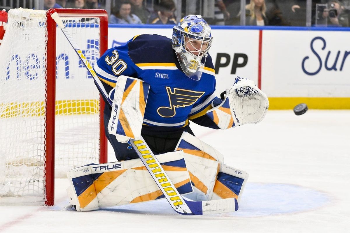 Apr 3, 2025; St. Louis, Missouri, USA;  St. Louis Blues goaltender Joel Hofer (30) defends the net against the Pittsburgh Penguins during the third period at Enterprise Center. Mandatory Credit: Jeff Curry-Imagn Images