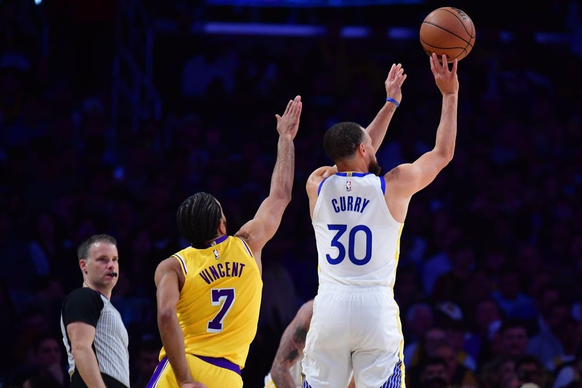 Apr 3, 2025; Los Angeles, California, USA; Golden State Warriors guard Stephen Curry (30) shoots against Los Angeles Lakers guard Gabe Vincent (7) during the first half at Crypto.com Arena. Mandatory Credit: Gary A. Vasquez-Imagn Images