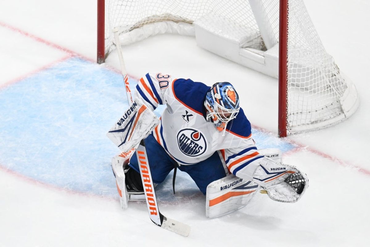 Apr 3, 2025; San Jose, California, USA; Edmonton Oilers goaltender Calvin Pickard (30) makes a save against the San Jose Sharks in the third period at SAP Center at San Jose. Mandatory Credit: Eakin Howard-Imagn Images