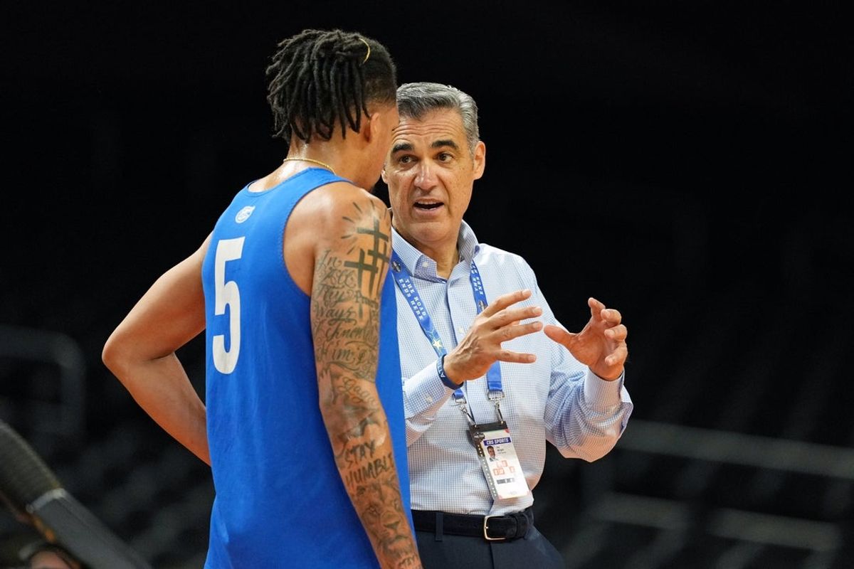 Apr 4, 2025; San Antonio, TX, USA; Florida Gators guard Will Richard (5) and TV personality Jay Wright during a practice session for the Final Four of the 2025 NCAA tournament at Alamodome. Mandatory Credit: Bob Donnan-Imagn Images