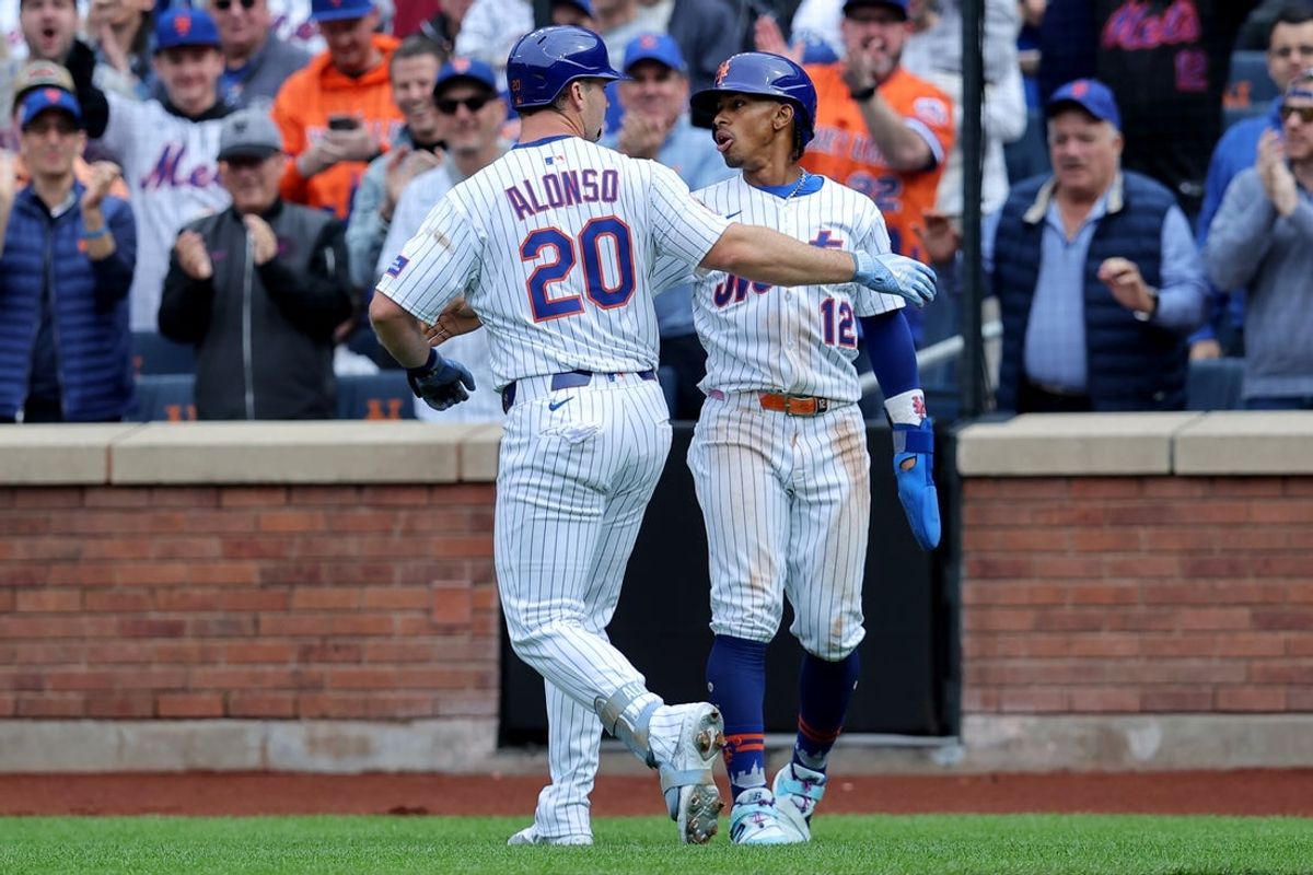Apr 4, 2025; New York City, New York, USA; New York Mets first baseman Pete Alonso (20) celebrates his two run home run against the Toronto Blue Jays with shortstop Francisco Lindor (12) during the first inning at Citi Field. Mandatory Credit: Brad Penner-Imagn Images