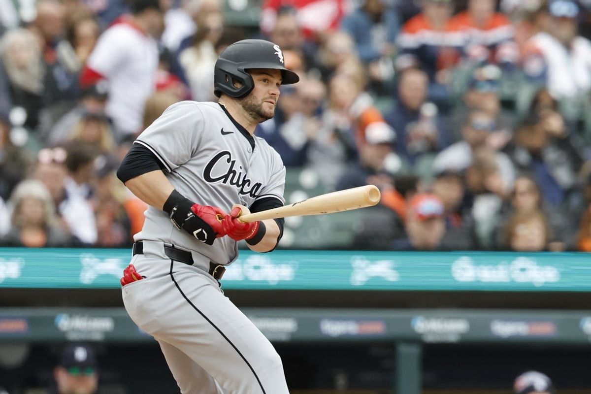 Apr 4, 2025; Detroit, Michigan, USA;  Chicago White Sox outfielder Andrew Benintendi (23) hits a single in the fifth inning against the Detroit Tigers at Comerica Park. Mandatory Credit: Rick Osentoski-Imagn Images
