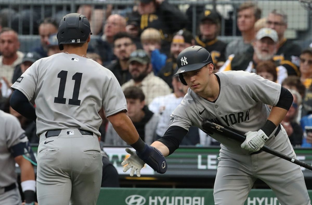 Apr 4, 2025; Pittsburgh, Pennsylvania, USA;  New York Yankees designated hitter Ben Rice (right) greets shortstop Anthony Volpe (11) crossing home plate to score a run against the Pittsburgh Pirates during the fourth inning at PNC Park. Mandatory Credit: Charles LeClaire-Imagn Images