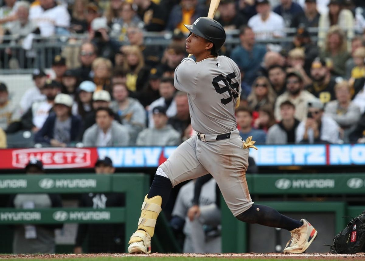 Apr 4, 2025; Pittsburgh, Pennsylvania, USA;  New York Yankees third baseman Oswaldo Cabrera (95) hits an RBI single against the Pittsburgh Pirates during the third inning at PNC Park. Mandatory Credit: Charles LeClaire-Imagn Images