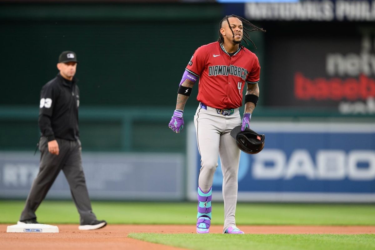 Apr 4, 2025; Washington, District of Columbia, USA; Arizona Diamondbacks second base Ketel Marte (4) reacts after injuring his leg during the first inning against the Washington Nationals at Nationals Park. Mandatory Credit: Reggie Hildred-Imagn Images