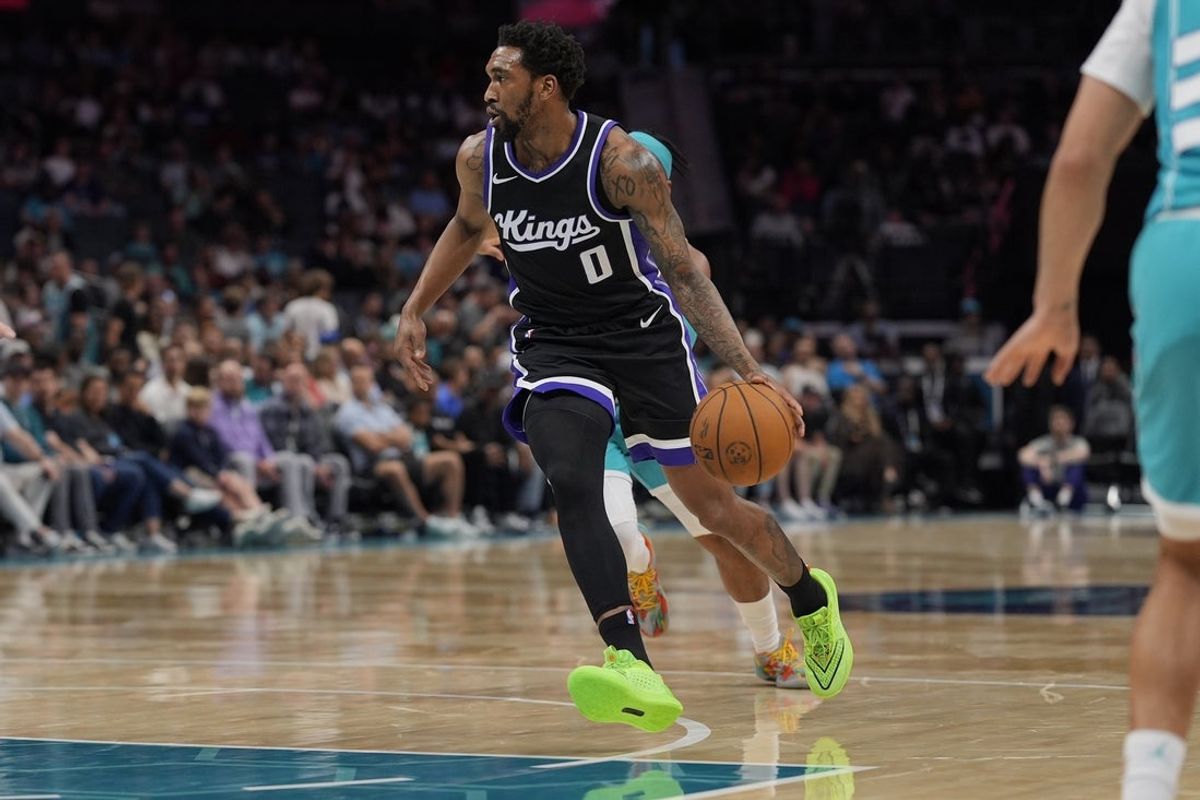 Apr 4, 2025; Charlotte, North Carolina, USA; Sacramento Kings guard Malik Monk (0) drives to the basket against the Charlotte Hornets during the second quarter at Spectrum Center. Mandatory Credit: Jim Dedmon-Imagn Images