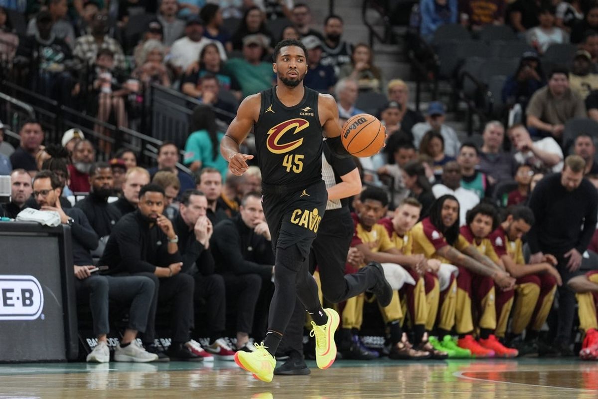Apr 4, 2025; San Antonio, Texas, USA;  Cleveland Cavaliers guard Donovan Mitchell (45) dribbles in the first half against the San Antonio Spurs at Frost Bank Center. Mandatory Credit: Daniel Dunn-Imagn Images