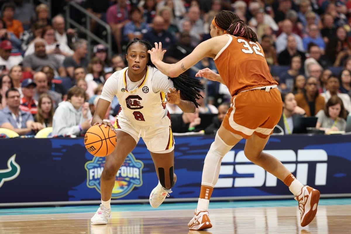Apr 4, 2025; Tampa, FL, USA;  South Carolina Gamecocks forward Joyce Edwards (8) drives against Texas Longhorns guard Ndjakalenga Mwenentanda (32) during the third quarter in a semifinal of the women's 2025 NCAA tournament at Amalie Arena. Mandatory Credit: Nathan Ray Seebeck-Imagn Images