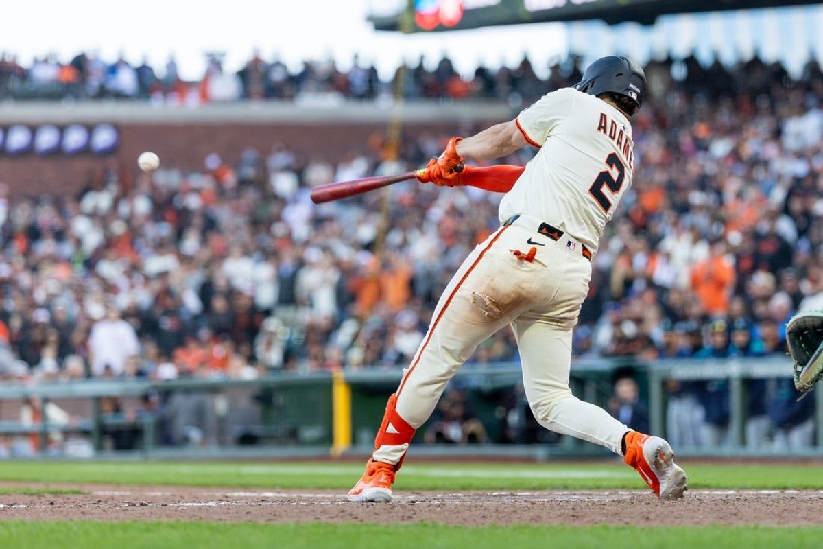 Apr 4, 2025; San Francisco, California, USA; San Francisco Giants shortstop Willy Adames (2) drives in two runs for a walk-off Giants win during the eleventh inning against the Seattle Mariners at Oracle Park. Mandatory Credit: Bob Kupbens-Imagn Images