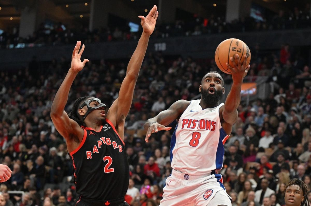 Apr 4, 2025; Toronto, Ontario, CAN;  Detroit Pistons guard Tim Hardaway Jr. (8) shoots the ball against Toronto Raptors forward Jonathan Mogbo (2) in the first half at Scotiabank Arena. Mandatory Credit: Dan Hamilton-Imagn Images