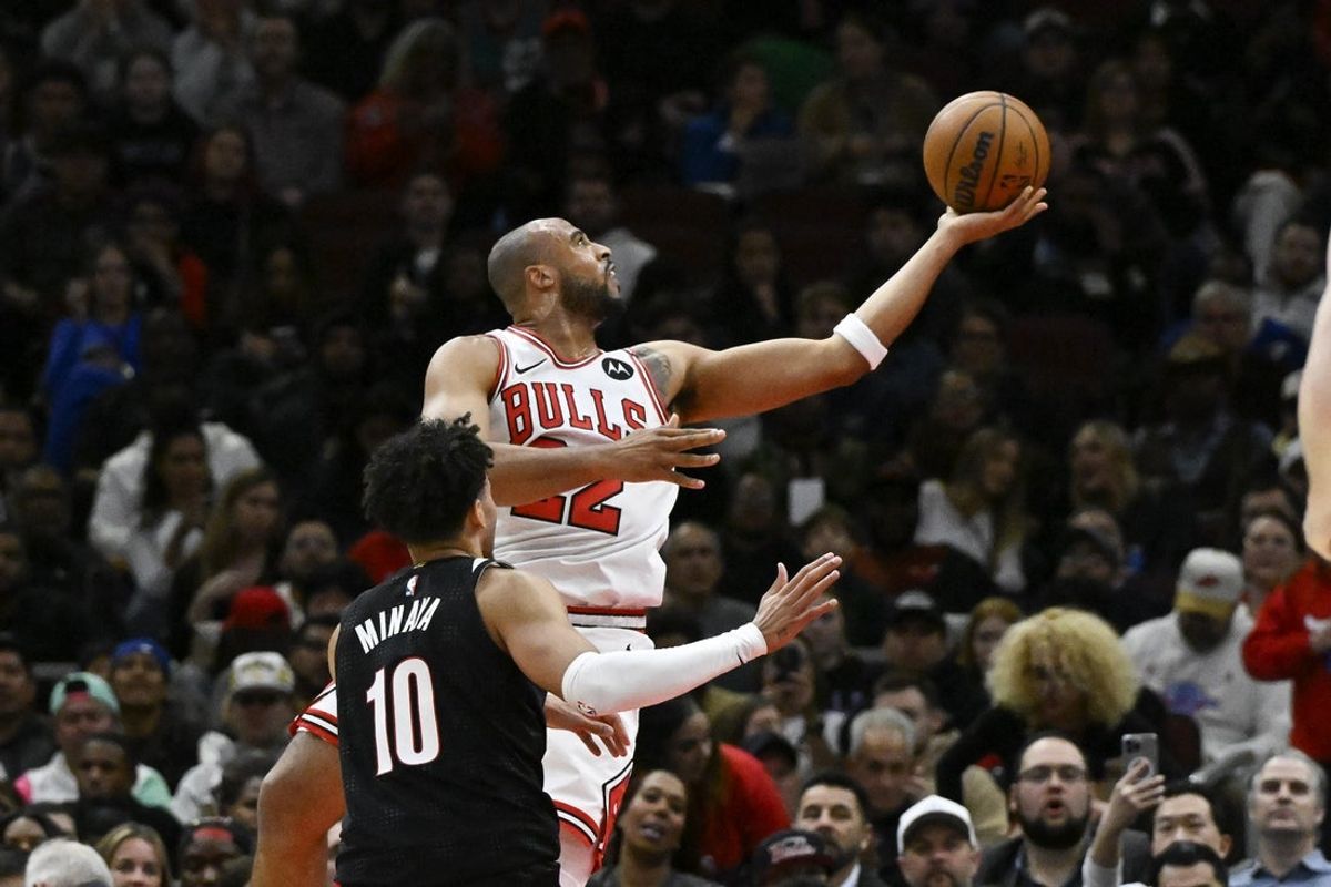 Apr 4, 2025; Chicago, Illinois, USA;  Chicago Bulls forward Talen Horton-Tucker (22) shoots past Portland Trail Blazers forward Justin Minaya (10) during the first half at United Center. Mandatory Credit: Matt Marton-Imagn Images