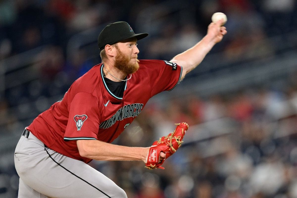 Apr 4, 2025; Washington, District of Columbia, USA; Arizona Diamondbacks pitcher A.J. Puk (33) throws a pitch during the eighth inning against the Washington Nationals at Nationals Park. Mandatory Credit: Reggie Hildred-Imagn Images