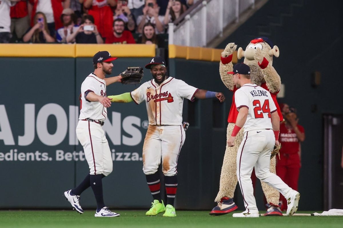 Apr 4, 2025; Atlanta, Georgia, USA; Atlanta Braves left fielder Eli White (36) and center fielder Michael Harris II (23) and left fielder Jarred Kelenic (24) celebrate after a victory over the Miami Marlins at Truist Park. Mandatory Credit: Brett Davis-Imagn Images