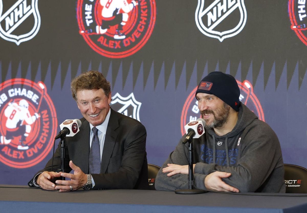 Apr 4, 2025; Washington, District of Columbia, USA; Washington Capitals left wing Alex Ovechkin (right) speaks at a press conference with Wayne Gretzky after the game against the Chicago Blackhawks at Capital One Arena. Ovechkin scored the 893rd and 894th goals of his career, tying Gretzky for most all-time goals in NHL history. Mandatory Credit: Geoff Burke-Imagn Images