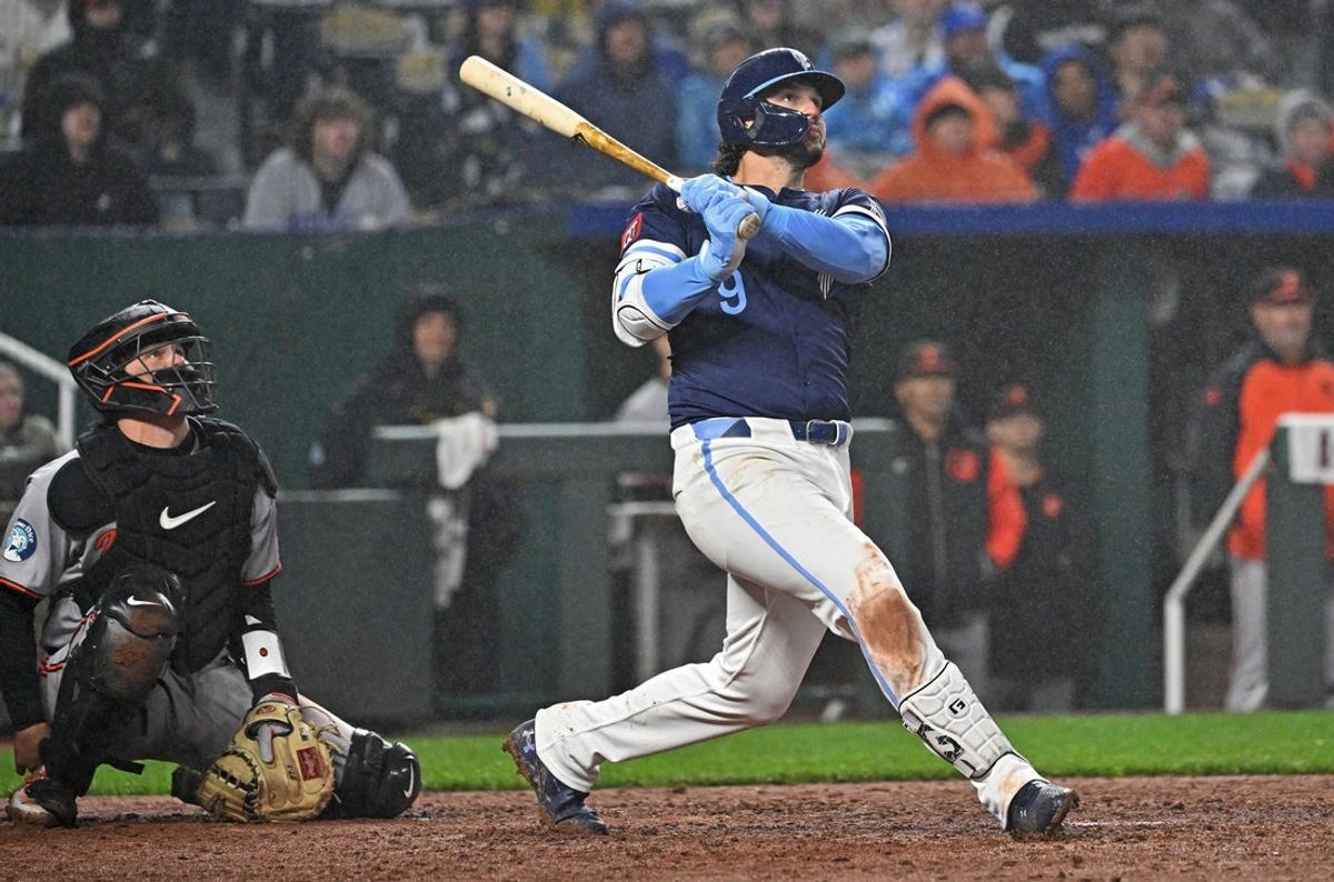 Apr 4, 2025; Kansas City, Missouri, USA;  Kansas City Royals first baseman Vinnie Pasquantino (9) drives in three runs with a single in the eighth inning against the Baltimore Orioles at Kauffman Stadium. Mandatory Credit: Peter Aiken-Imagn Images
