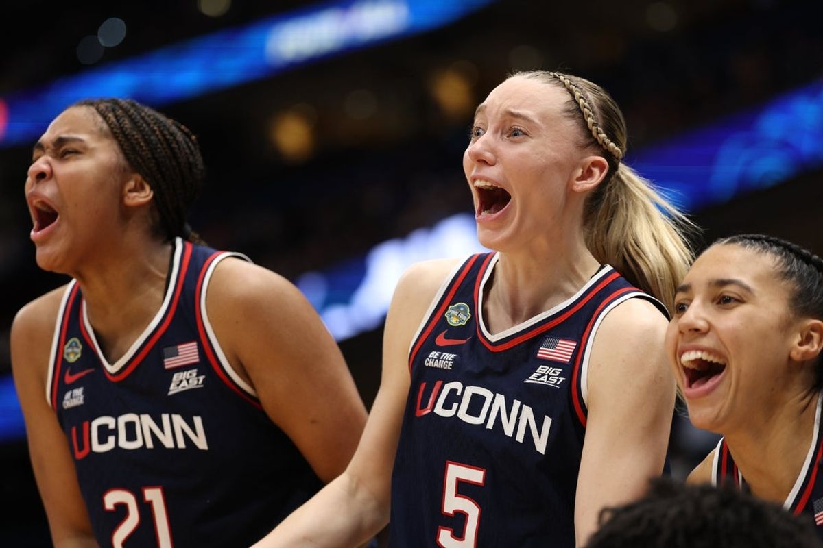 Apr 4, 2025; Tampa, FL, USA;  Connecticut Huskies guard Paige Bueckers (5) and forward Sarah Strong (21) react on the bench during the fourth quarter in a semifinal of the women's 2025 NCAA tournament against the UCLA Bruins at Amalie Arena. Mandatory Credit: Nathan Ray Seebeck-Imagn Images